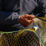 fisherman working on a net